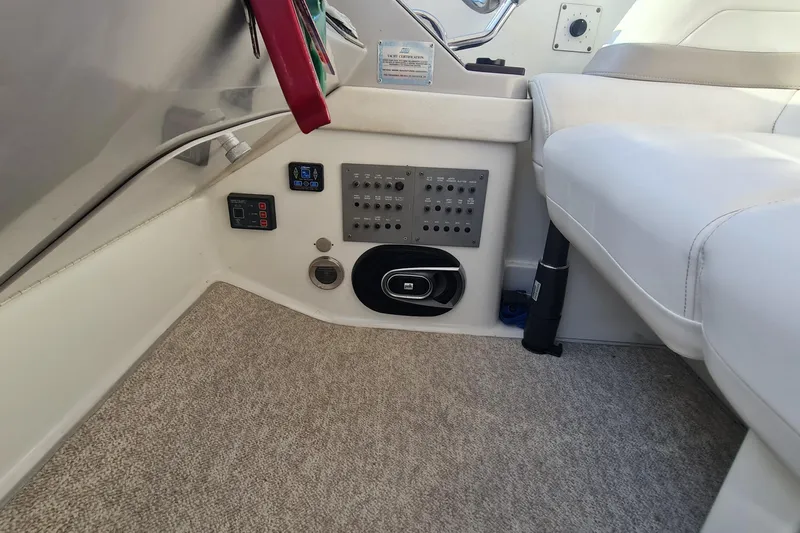  Yacht Photos Pics 1998 Formula 41 Performance Cruiser interior with control panel and seating area.