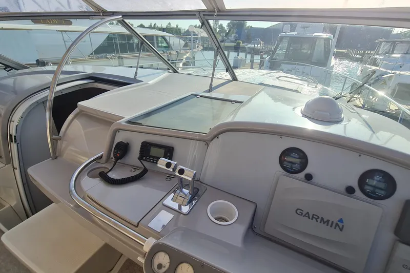 Yacht Photos Pics 1998 Formula 41 Performance Cruiser helm with Garmin navigation, docked at marina.