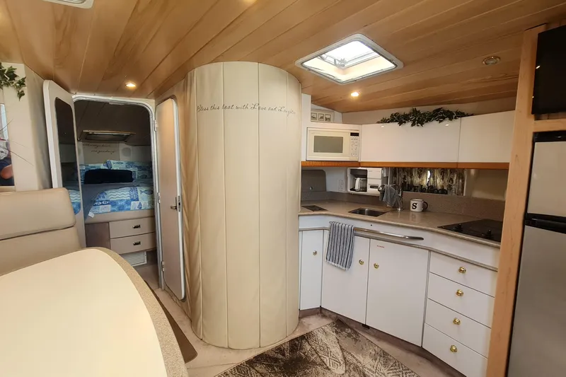  Yacht Photos Pics Interior of 1998 Formula 41 Performance Cruiser with modern kitchen and cozy bedroom.