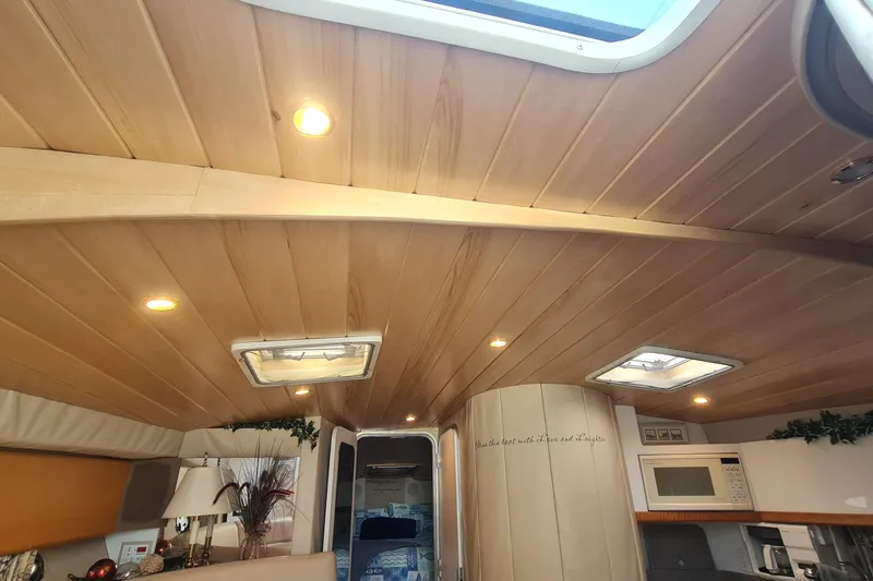  Yacht Photos Pics Interior of 1998 Formula 41 Performance Cruiser with wooden ceiling and modern amenities.