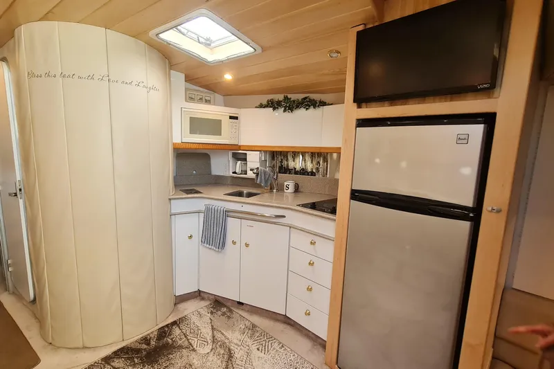  Yacht Photos Pics 1998 Formula 41 Performance Cruiser kitchen with modern appliances and cozy design.
