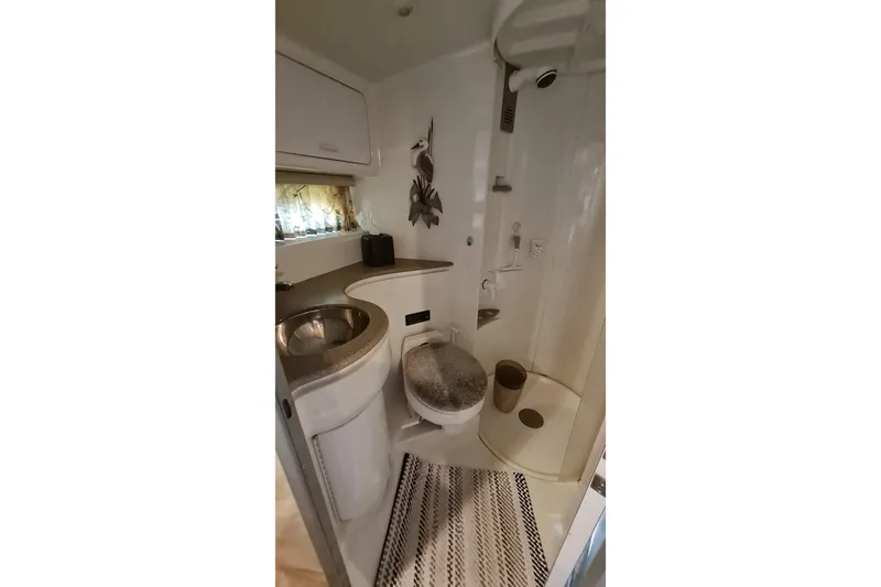  Yacht Photos Pics Bathroom interior of 1998 Formula 41 Performance Cruiser with shower and sink.