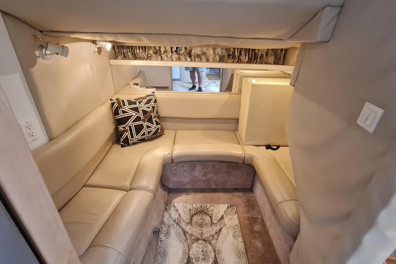  Yacht Photos Pics 1998 Formula 41 Performance Cruiser interior with beige seating and decorative pillow.