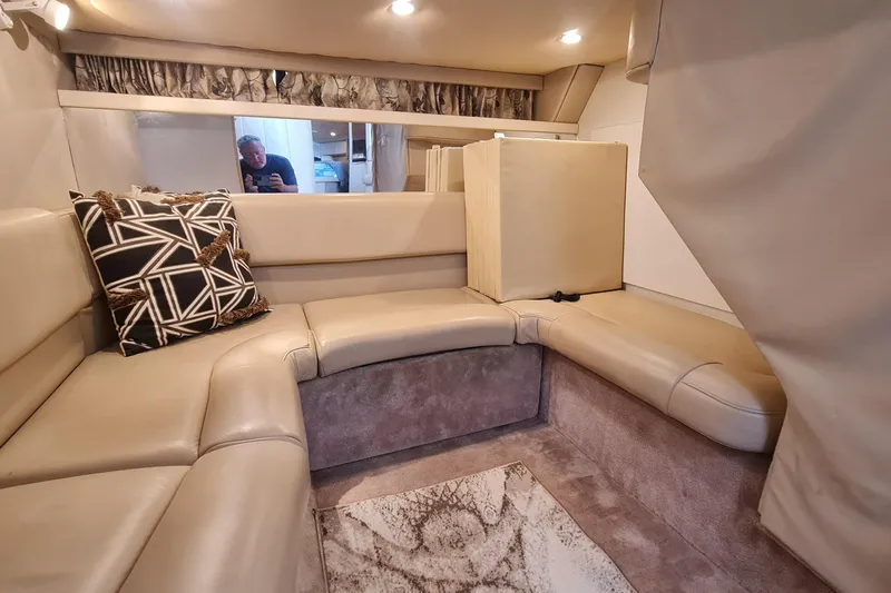  Yacht Photos Pics Luxurious interior of a 1998 Formula 41 Performance Cruiser with beige seating and geometric pillow.