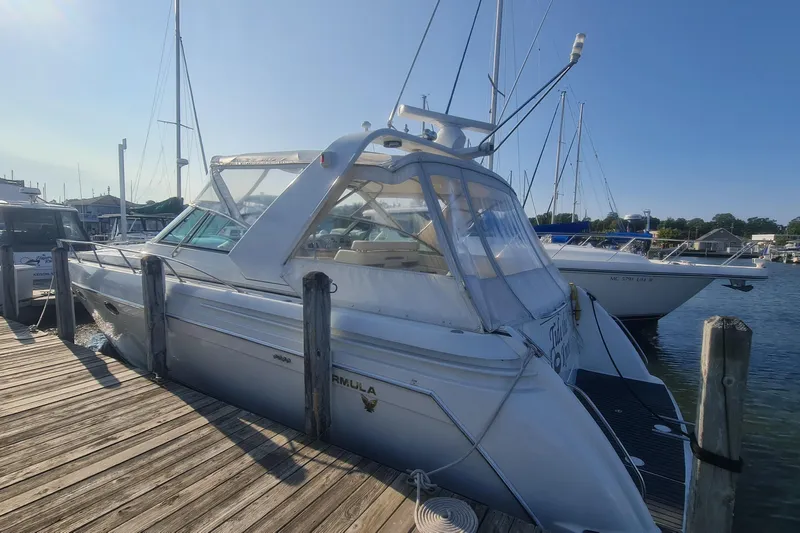 Yacht Photos Pics 1998 Formula 41 Performance Cruiser docked at marina under clear blue sky.