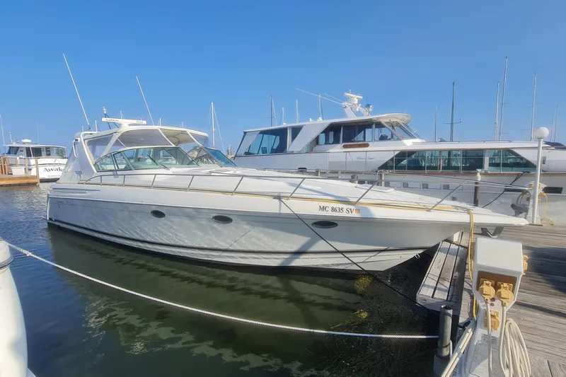 Yacht Photos Pics 1998 Formula 41 Performance Cruiser docked at marina under clear blue sky.