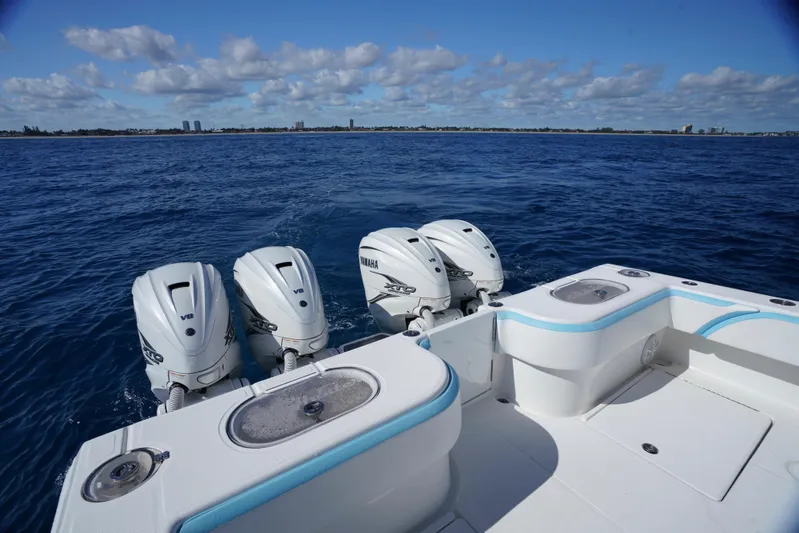  Yacht Photos Pics 2020 SeaHunter 46 CTS boat with four powerful outboard engines on open water.
