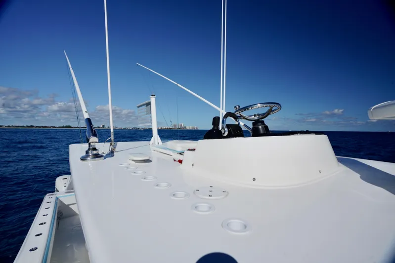  Yacht Photos Pics SeaHunter 46 CTS 2020 boat deck with steering wheel, ocean view, clear blue sky.