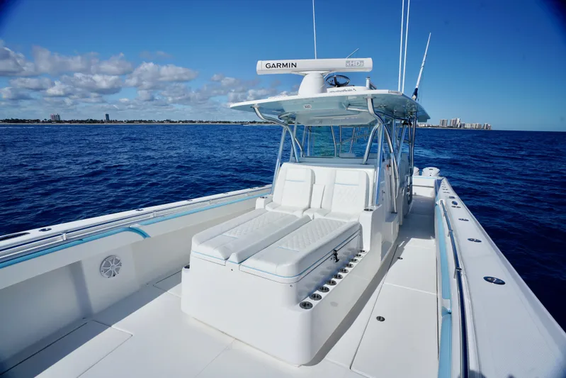  Yacht Photos Pics 2020 SeaHunter 46 CTS boat on open ocean, clear sky, and distant shoreline.
