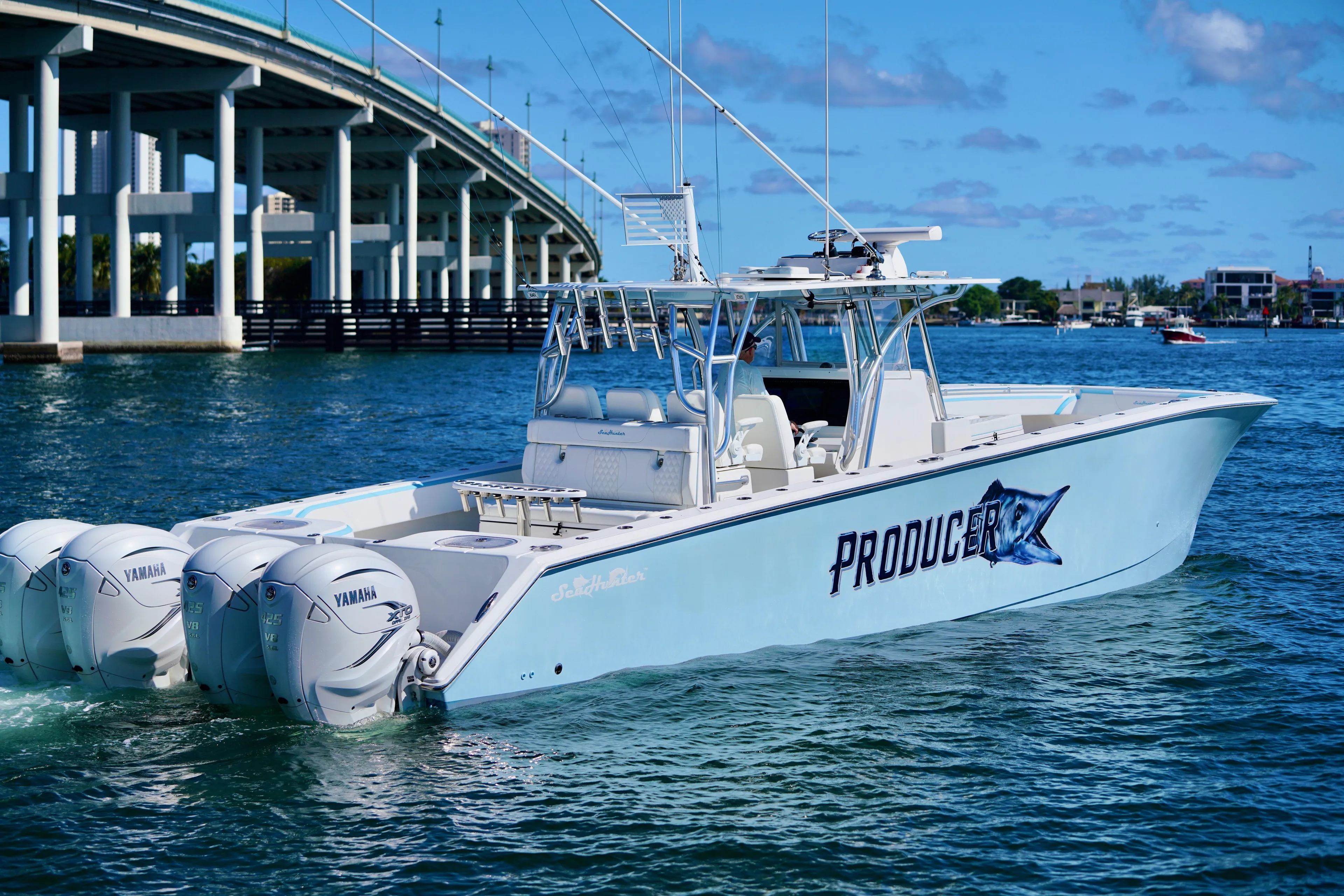  Yacht Photos Pics 2020 SeaHunter 46 CTS boat with Yamaha engines on water near a bridge.