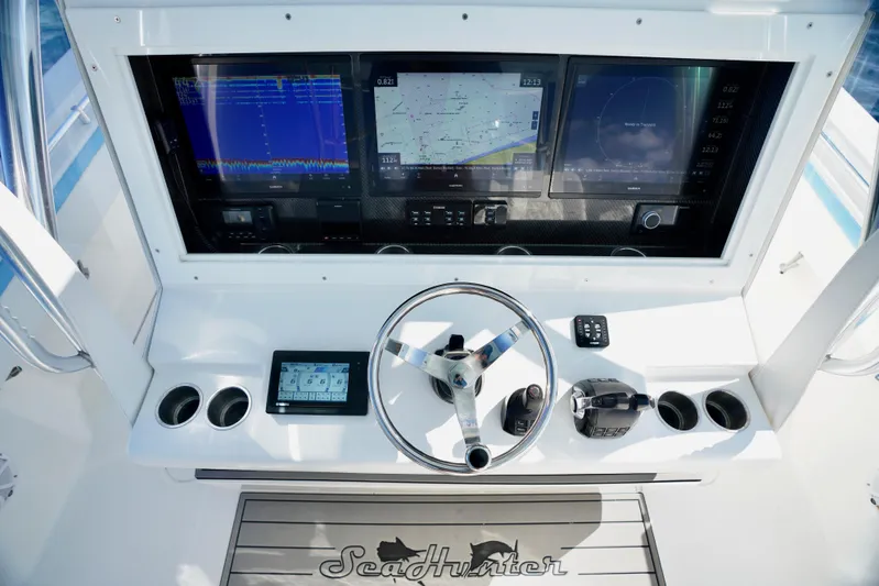  Yacht Photos Pics 2020 SeaHunter 46 CTS boat dashboard with advanced navigation screens and controls.