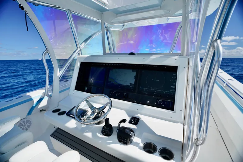  Yacht Photos Pics 2020 SeaHunter 46 CTS helm with advanced navigation system on open ocean.