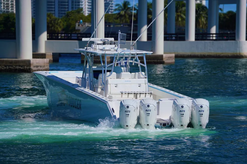 Yacht Photos Pics 2020 SeaHunter 46 CTS boat with four engines cruising in clear water.