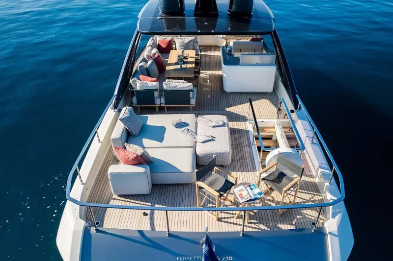  Yacht Photos Pics Luxurious 2021 Ferretti Yachts 780 with elegant deck seating and ocean view.