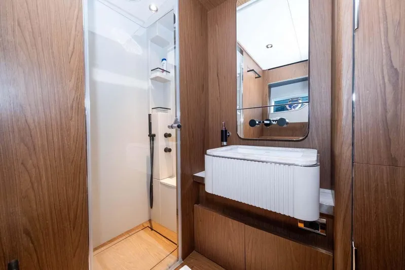  Yacht Photos Pics Luxurious bathroom interior on 2021 Ferretti Yachts 780, featuring wood paneling and modern fixtures.