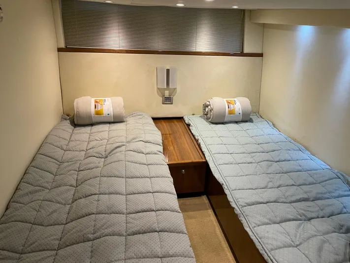  Yacht Photos Pics Interior cabin of 2008 Cobalt 46 yacht with twin beds and cozy bedding.