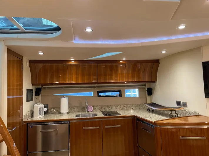  Yacht Photos Pics Luxurious kitchen interior of 2008 Cobalt 46 yacht with modern amenities and wood finish.