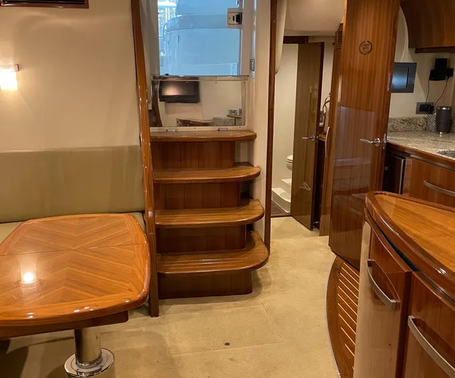  Yacht Photos Pics Luxurious interior of 2008 Cobalt 46 yacht with wooden finishes and modern amenities.