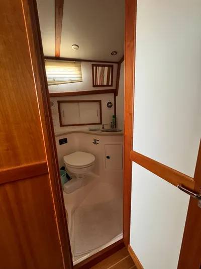  Yacht Photos Pics 2005 Sabre 38 yacht bathroom with wooden accents and compact design.
