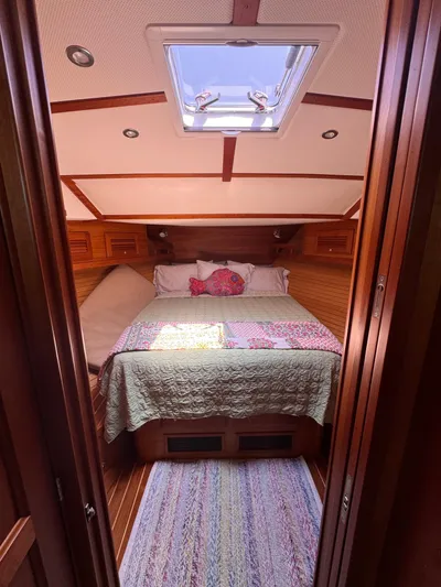  Yacht Photos Pics Cozy cabin interior of 2005 Sabre 38 sailboat with skylight and bed.