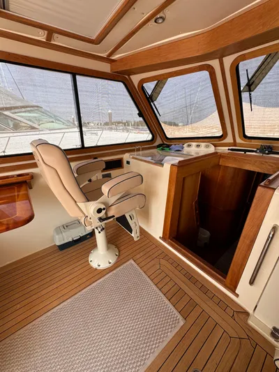  Yacht Photos Pics Interior of 2005 Sabre 38 boat with wooden accents and captain's chair.