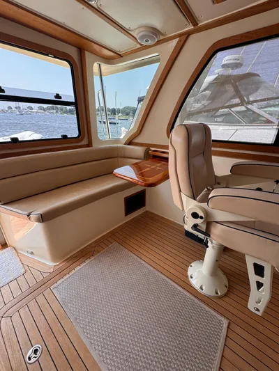  Yacht Photos Pics Interior of 2005 Sabre 38 yacht with leather seating and wooden flooring.