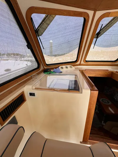  Yacht Photos Pics Interior of 2005 Sabre 38 boat with wooden trim and large windows.