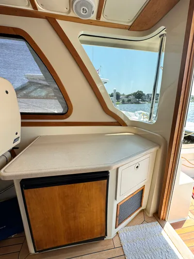  Yacht Photos Pics Interior of 2005 Sabre 38 boat with wooden cabinetry and window view.