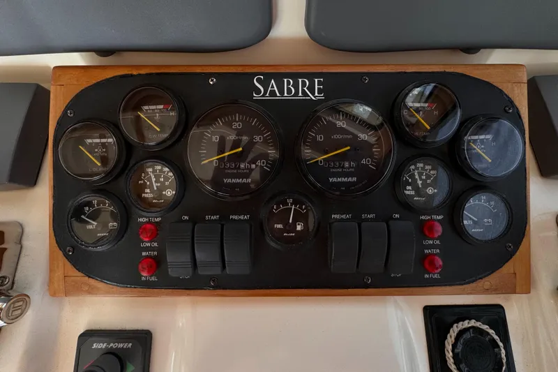  Yacht Photos Pics Control panel of a 2005 Sabre 38 boat with various gauges and switches.