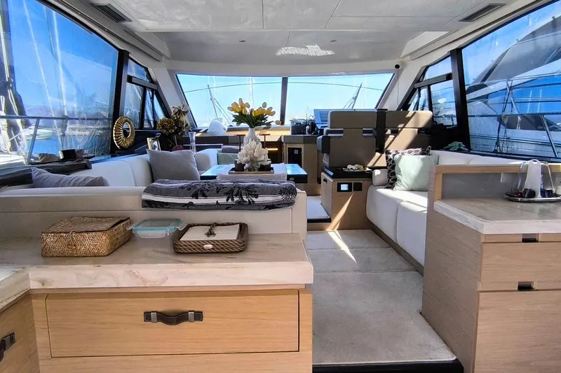  Yacht Photos Pics Luxurious interior of 2020 Beneteau Monte Carlo 52 yacht with modern furnishings and decor.