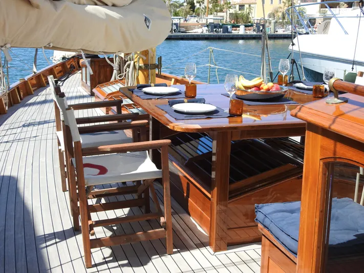 Armide Yacht Photos Pics 1938 Custom By Classic Works yacht with elegant wooden dining area on deck.