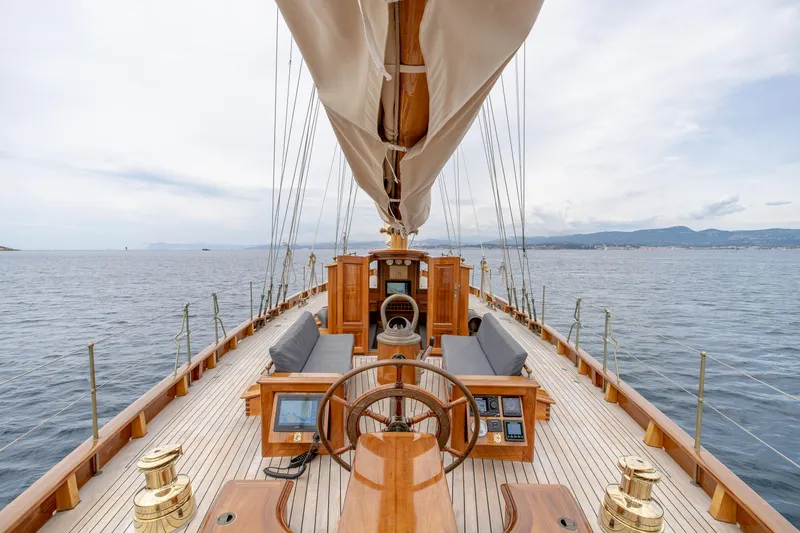 Armide Yacht Photos Pics 1938 Custom sailboat by Classic Works, elegant wooden deck, open sea view.