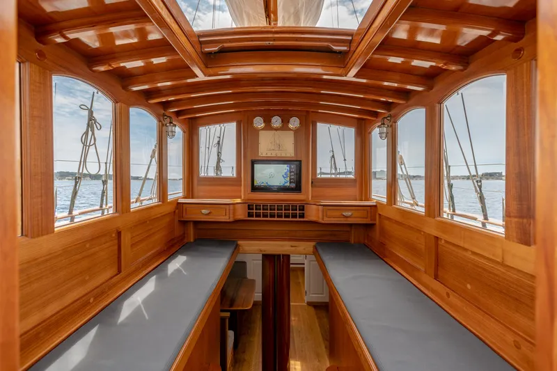 Armide Yacht Photos Pics 1938 Custom By Classic Works boat interior with wooden finish and panoramic windows.