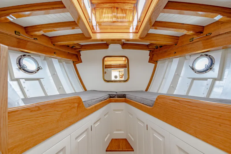 Armide Yacht Photos Pics 1938 Custom boat interior by Classic Works, featuring wooden beams and portholes.