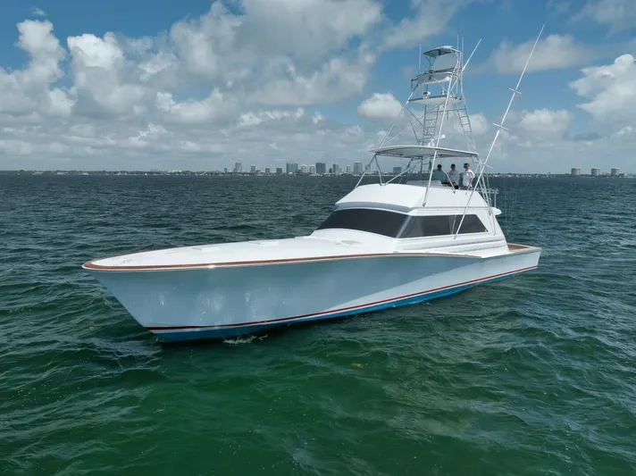 Bird Dog Yacht Photos Pics 1989 Jim Smith Custom Convertible yacht cruising on open water under a cloudy sky.