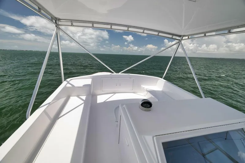 Bird Dog Yacht Photos Pics 1989 Jim Smith Custom Convertible boat deck with ocean view under clear sky.