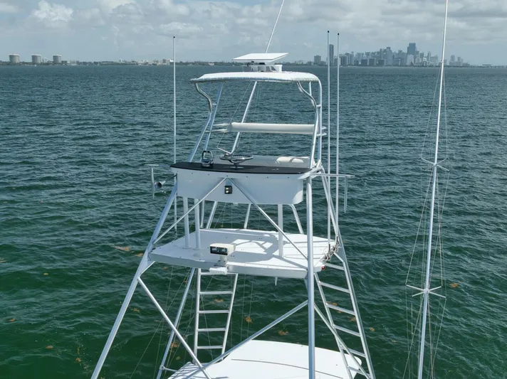 Bird Dog Yacht Photos Pics 1989 Jim Smith Custom Convertible boat on water with city skyline in background.