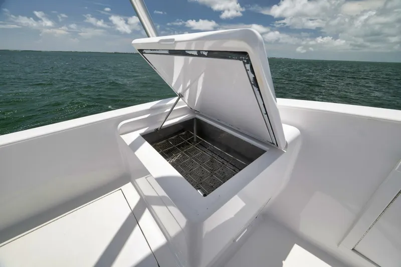 Bird Dog Yacht Photos Pics Open storage compartment on 1989 Jim Smith Custom Convertible boat, ocean view.