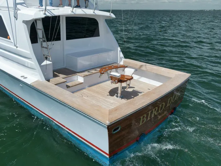 Bird Dog Yacht Photos Pics 1989 Jim Smith Custom Convertible yacht on open water, featuring a spacious deck.