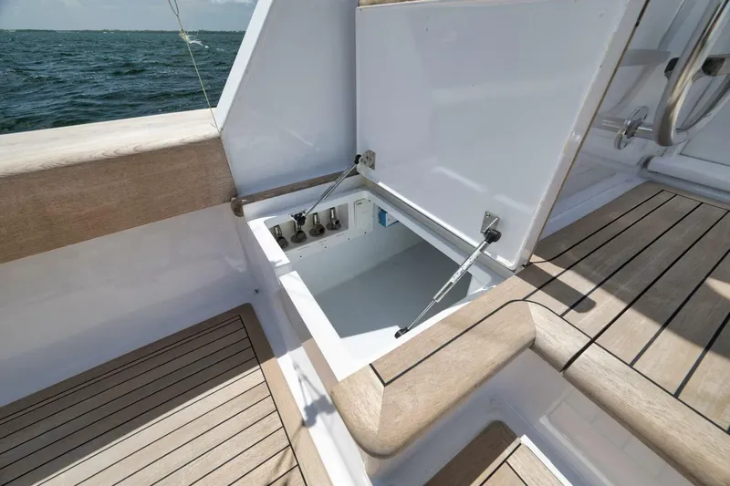 Bird Dog Yacht Photos Pics Open storage compartment on 1989 Jim Smith Custom Convertible boat deck.