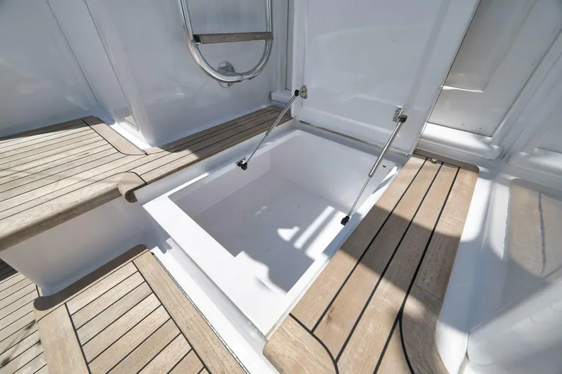 Bird Dog Yacht Photos Pics 1989 Jim Smith Custom Convertible boat deck with open storage compartment.