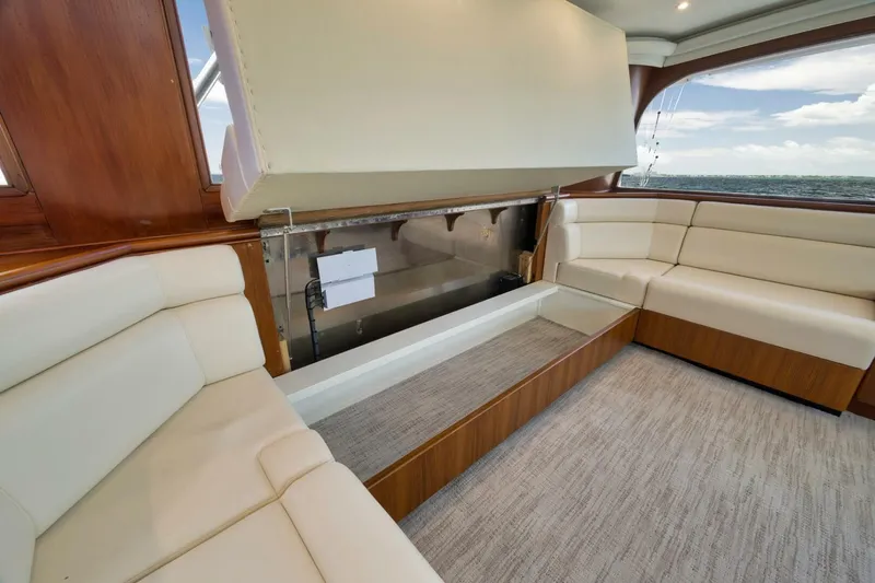 Bird Dog Yacht Photos Pics Luxurious interior of 1989 Jim Smith Custom Convertible yacht with cream leather seating.