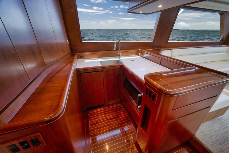 Bird Dog Yacht Photos Pics Luxurious wooden interior of 1989 Jim Smith Custom Convertible yacht with ocean view.