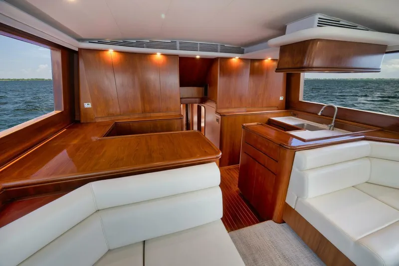 Bird Dog Yacht Photos Pics Luxurious 1989 Jim Smith Custom Convertible yacht interior with wood finish and ocean view.
