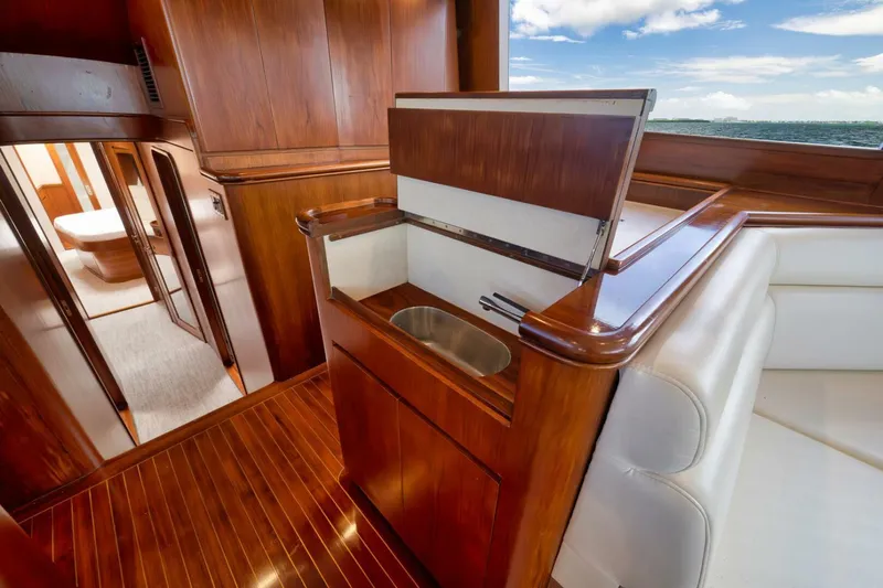 Bird Dog Yacht Photos Pics Luxurious wooden interior of 1989 Jim Smith Custom Convertible yacht with ocean view.