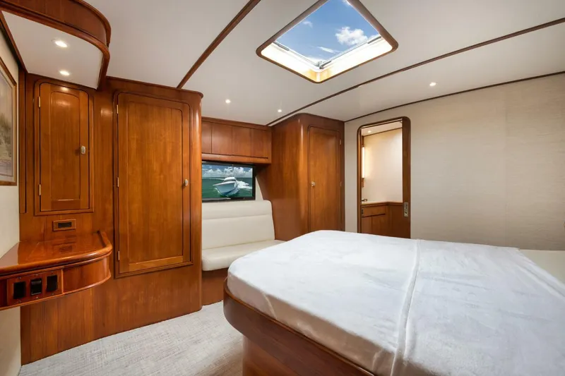 Bird Dog Yacht Photos Pics Luxurious cabin interior of 1989 Jim Smith Custom Convertible yacht with wooden furnishings and skylight.