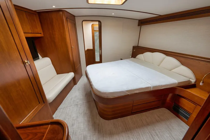 Bird Dog Yacht Photos Pics Luxurious cabin interior of 1989 Jim Smith Custom Convertible yacht with wooden furnishings.