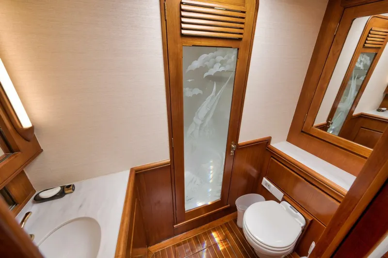 Bird Dog Yacht Photos Pics Luxurious wooden bathroom interior in 1989 Jim Smith Custom Convertible yacht.