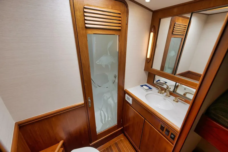 Bird Dog Yacht Photos Pics Luxurious wooden bathroom interior in 1989 Jim Smith Custom Convertible yacht.
