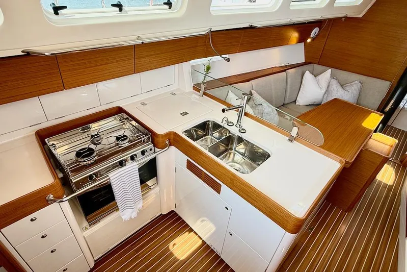 Spectre Yacht Photos Pics Luxurious 2016 X-Yachts Xp38 yacht interior with modern kitchen and cozy seating area.